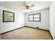 This cozy bedroom features a ceiling fan, two windows, and ample natural light at 2846 Spring Lake Dr, Buford, GA 30519