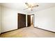 Bedroom with a closet, ceiling fan, and view into the hallway at 2846 Spring Lake Dr, Buford, GA 30519