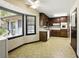 Bright kitchen featuring wood cabinetry, white appliances, and large windows for great light at 2846 Spring Lake Dr, Buford, GA 30519