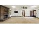 Large living room featuring neutral carpet, brick fireplace, and multiple windows at 2846 Spring Lake Dr, Buford, GA 30519