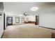Spacious living room featuring neutral carpet, ceiling fan and multiple windows at 2846 Spring Lake Dr, Buford, GA 30519