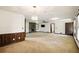 Spacious living room featuring neutral carpet, brick fireplace and multiple windows at 2846 Spring Lake Dr, Buford, GA 30519