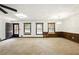 Bright living room featuring neutral carpet and multiple windows at 2846 Spring Lake Dr, Buford, GA 30519