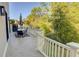 Wide back deck with outdoor seating offers serene views of the lush backyard and mature trees at 3890 The Battery, Duluth, GA 30096