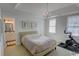 Bright bedroom features an ensuite bathroom and an ornate light fixture, with lots of natural light at 3890 The Battery, Duluth, GA 30096