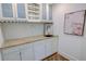 Charming butler's pantry with granite counters, wine rack, sink, and stylish decor at 3890 The Battery, Duluth, GA 30096