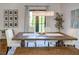 Cozy dining area featuring a large wood table, comfortable seating, and modern lighting at 3890 The Battery, Duluth, GA 30096