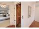 Hallway with elevator and view of bedroom with decorative wall art and chandelier at 3890 The Battery, Duluth, GA 30096