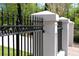 Detailed view of the wrought iron fence and stone pillars, providing security and enhancing curb appeal at 3890 The Battery, Duluth, GA 30096