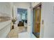 Hallway featuring an elevator and a view into the home theater with reclining seating at 3890 The Battery, Duluth, GA 30096