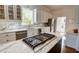 Stylish kitchen with marble countertops, modern appliances, and a gas stovetop on a center island at 3890 The Battery, Duluth, GA 30096