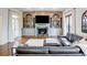 Comfortable living room with built-in bookshelves, a fireplace, and a large leather sofa at 3890 The Battery, Duluth, GA 30096
