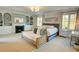 Spacious main bedroom features a fireplace, built-in shelving, and plenty of natural light from windows at 3890 The Battery, Duluth, GA 30096