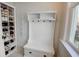 Mudroom with a built-in bench and shoe storage for organization as you enter the home at 3890 The Battery, Duluth, GA 30096