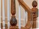 A close up on a beautifully designed staircase showcasing detailed trim, and natural wood features at 3890 The Battery, Duluth, GA 30096