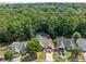 Serene aerial view of home showcasing pool, lush greenery, and neighborhood at 436 Suwanee East Dr, Lawrenceville, GA 30043