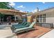 Backyard patio with multiple seating areas, a privacy fence, and lush landscaping at 436 Suwanee East Dr, Lawrenceville, GA 30043