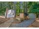 Backyard features a brick path, shed, and small fenced enclosure at 436 Suwanee East Dr, Lawrenceville, GA 30043