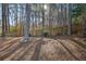 Spacious backyard with mature trees and wooden fence offering privacy at 436 Suwanee East Dr, Lawrenceville, GA 30043
