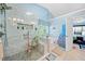 Walk-in shower and soaking tub in a light and bright bathroom with accessibility features at 436 Suwanee East Dr, Lawrenceville, GA 30043