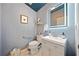 Beautiful half-bathroom with modern fixtures, stylish wallpaper and vessel sink at 436 Suwanee East Dr, Lawrenceville, GA 30043