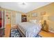 Bedroom with a queen bed, wood floors, closet, and nightstand at 436 Suwanee East Dr, Lawrenceville, GA 30043