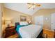 Cozy bedroom with vaulted ceilings, ceiling fan, and beautiful hardwood floors at 436 Suwanee East Dr, Lawrenceville, GA 30043