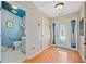Inviting foyer with hardwood floors, a decorative front door, and a powder room to the left at 436 Suwanee East Dr, Lawrenceville, GA 30043