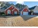 Attractive one story brick home with a well-manicured lawn and a two-car garage at 436 Suwanee East Dr, Lawrenceville, GA 30043