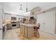 Bright kitchen featuring stainless steel appliances, an island, and tile flooring at 436 Suwanee East Dr, Lawrenceville, GA 30043