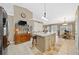 Eat-in kitchen boasts an island with seating, stainless appliances, and tile floors at 436 Suwanee East Dr, Lawrenceville, GA 30043