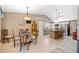 Kitchen view features tile floors, a vaulted ceiling, and an island with bar stool seating, plus a dining area at 436 Suwanee East Dr, Lawrenceville, GA 30043