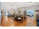 Spacious living room featuring hardwood floors, vaulted ceilings, multiple seating areas, and generous natural light at 436 Suwanee East Dr, Lawrenceville, GA 30043