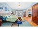 Primary bedroom with wood floors, ceiling fan, and natural light from the window at 436 Suwanee East Dr, Lawrenceville, GA 30043
