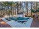A closed in-ground pool featuring a shed surrounded by tall mature trees at 436 Suwanee East Dr, Lawrenceville, GA 30043