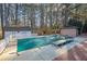A closed in-ground pool featuring a shed and a gazebo surrounded by tall mature trees at 436 Suwanee East Dr, Lawrenceville, GA 30043