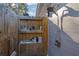 Outdoor shower with mounted shower head, soap storage, and privacy fencing at 436 Suwanee East Dr, Lawrenceville, GA 30043