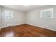 Bedroom with wooden floors and windows at 8586 Taylor Rd, Riverdale, GA 30274