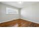 Bedroom with wooden floors and a window at 8586 Taylor Rd, Riverdale, GA 30274