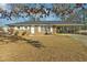 Charming brick home with a covered parking area and a well-maintained front yard at 8586 Taylor Rd, Riverdale, GA 30274