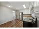 Traditional kitchen with stainless steel appliances and wooden floors at 8586 Taylor Rd, Riverdale, GA 30274