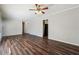 Spacious living room featuring sleek hardwood floors and neutral paint at 8586 Taylor Rd, Riverdale, GA 30274