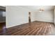 Bright living room featuring sleek hardwood floors and modern ceiling fan at 8586 Taylor Rd, Riverdale, GA 30274