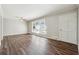Bright living room featuring sleek hardwood floors and modern ceiling fan at 8586 Taylor Rd, Riverdale, GA 30274