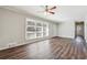 Bright living room featuring sleek hardwood floors, neutral paint and modern windows at 8586 Taylor Rd, Riverdale, GA 30274