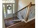 Inviting entryway with hardwood floors, a stylish staircase, and a welcoming front door at 106 Creek Crossing Ln, Temple, GA 30179