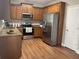 Well-equipped kitchen with stainless steel appliances, granite countertops, and beautiful wood cabinets at 106 Creek Crossing Ln, Temple, GA 30179