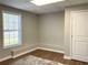 Versatile room with wood-look flooring, neutral paint and ample natural light at 106 Creek Crossing Ln, Temple, GA 30179