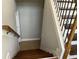 Staircase with stained wood steps and wrought iron spindles at 106 Creek Crossing Ln, Temple, GA 30179