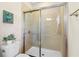 Bathroom featuring a glass enclosed shower and tiled walls at 120 Chastain Nw Rd # 608, Kennesaw, GA 30144